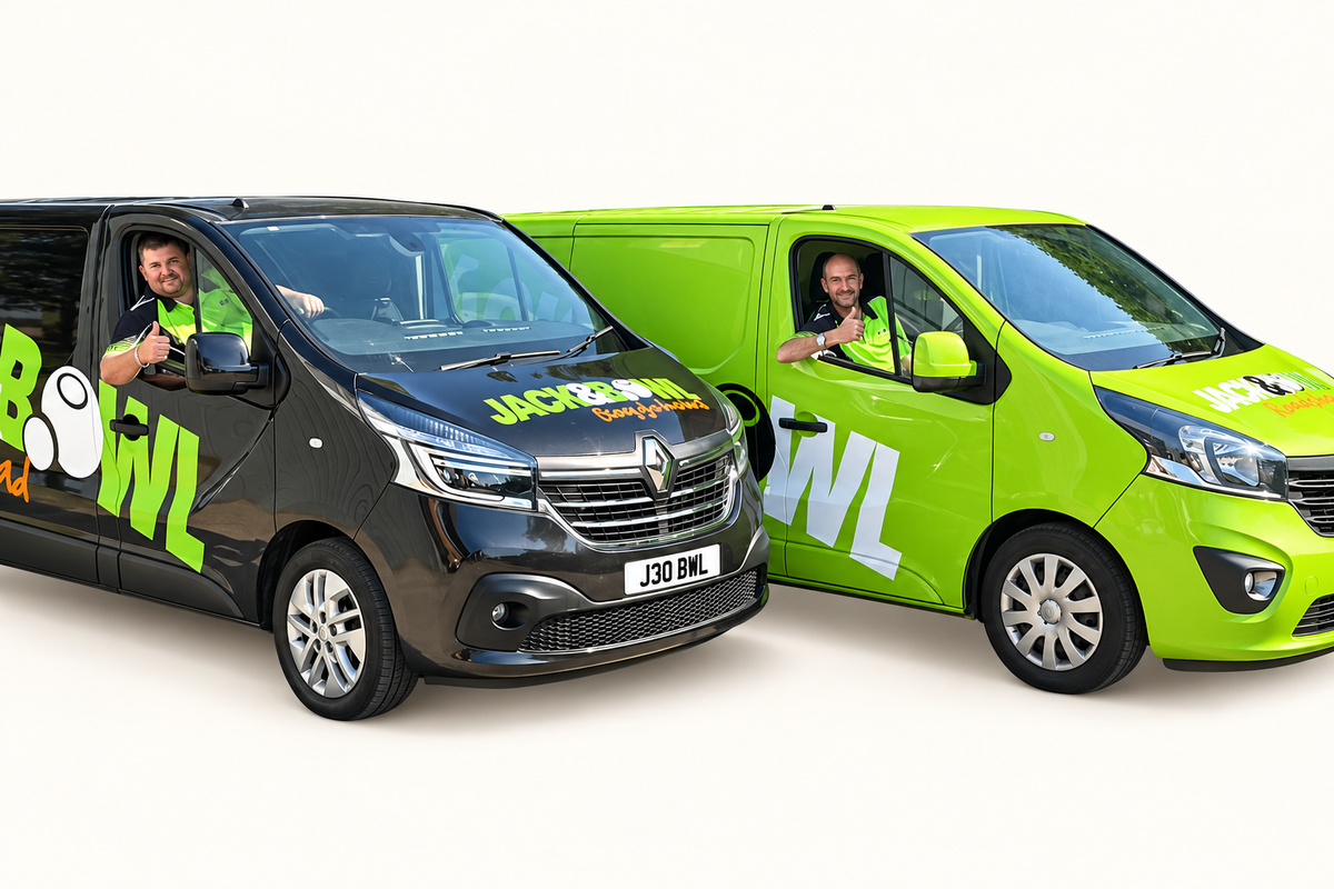Jack and Bowl roadshow team in the black and green branded vans